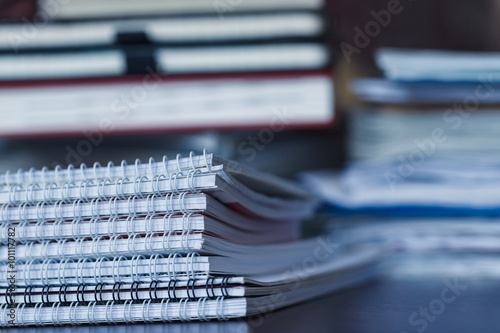 Large pile of magazine, notebook and books closeup