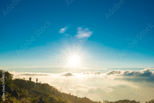 Morning landscape of sunrise over mountains peak with fog