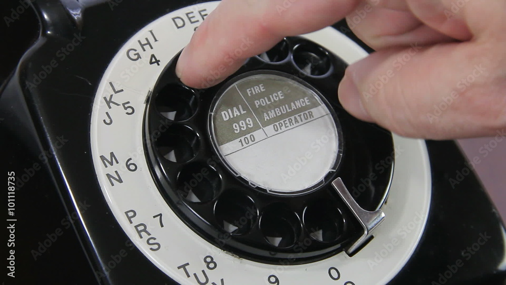 Close up of a man's hand dialling a number on a mid 20th century UK ...