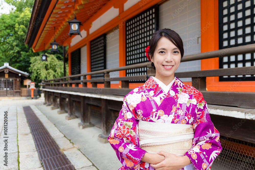 Japanese Woman with kimono dress at traditional temple