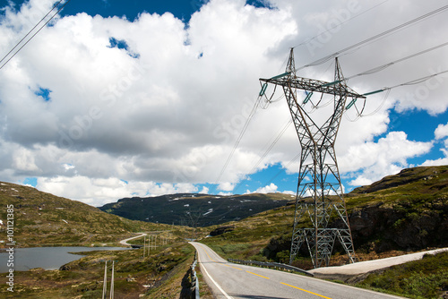 Landscape with mountain road and high voltage reliance line, Norway