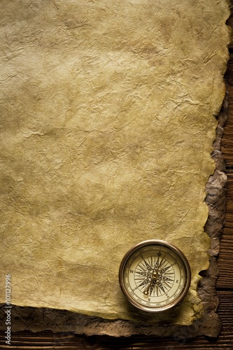 Close up view of the Compass on the old paper background