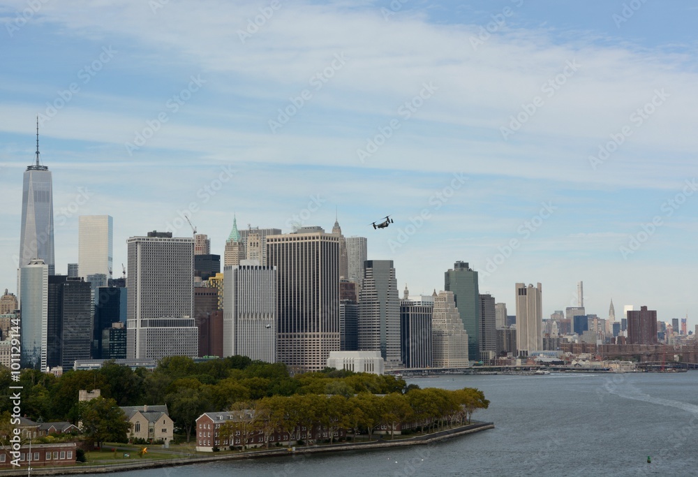New York skyline with the Marine Helicopter Osprey responsible for the transportation of VIP of the United States in the sky New York skyline with the Marine Helicopter Osprey responsible for the transportation of VIP of the United States in the sky