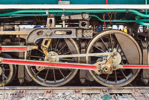 Steam locomotive wheels and rods closeup