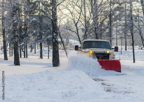 Snow plow doing snow removal after a blizzard