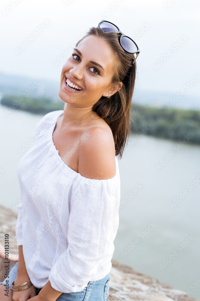 Portrait of a beautiful young woman posing outdoors