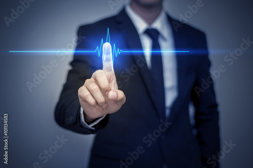 Businessman in suit working with digital virtual screen