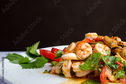 Spicy shrimp, mussel, squid salad hot and sour. Thai food.