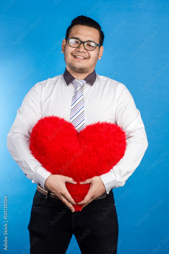 valentine romantic happy man showing his love place on blue back valentine romantic happy man showing his love place on blue back