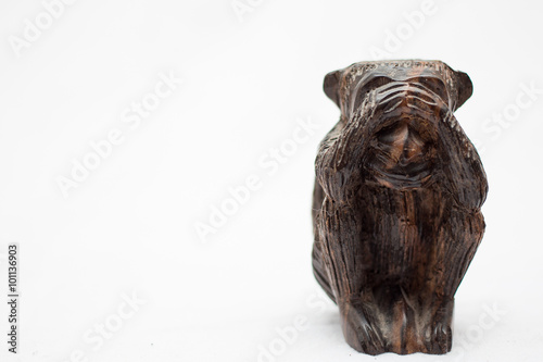 wood monkeys statues on a white background 