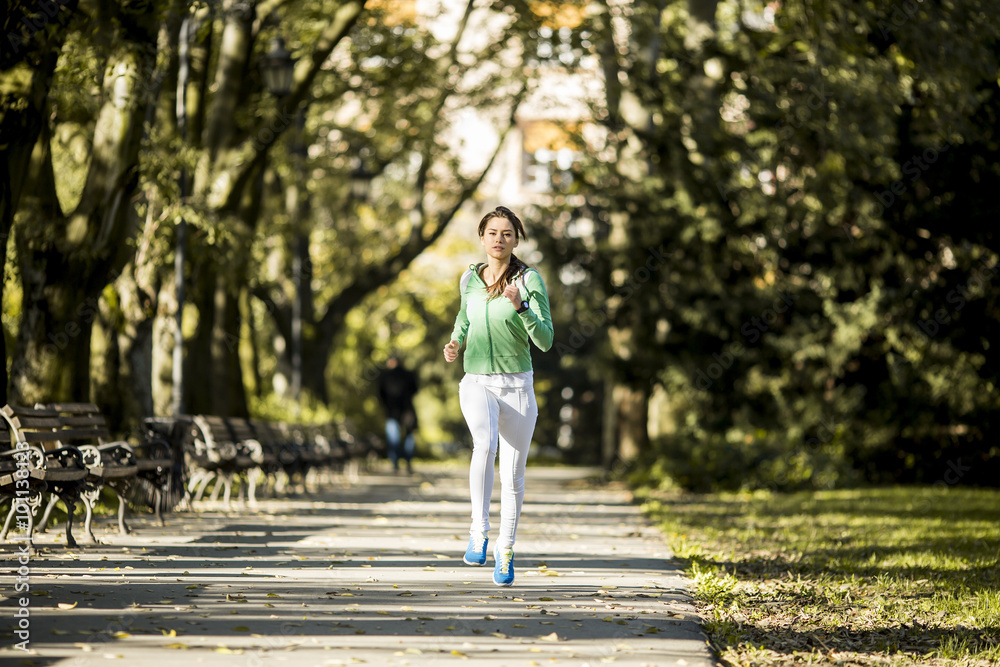 Young woman running in the park Young woman running in the park