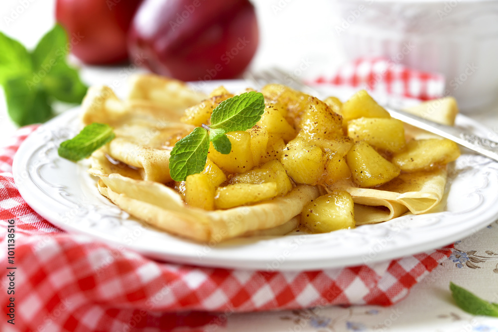 Thin pancakes with caramelised apples and cinnamon. Thin pancakes with caramelised apples and cinnamon.