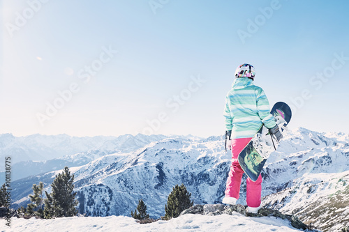 Young woman with snowboard