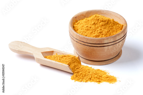 Ground turmeric isolated on white