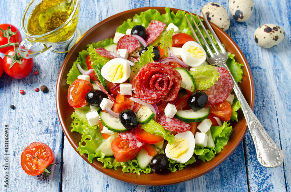 Salad with fresh vegetables, feta cheese, quail eggs, olives and