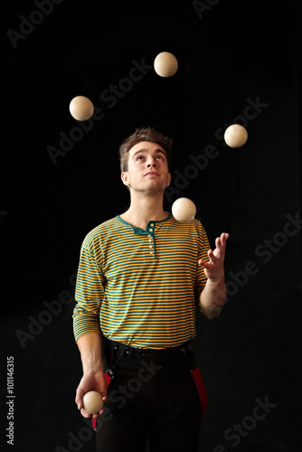 Young boy juggling