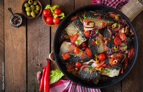 Grilled mackerel with vegetables in Mediterranean style. Top view