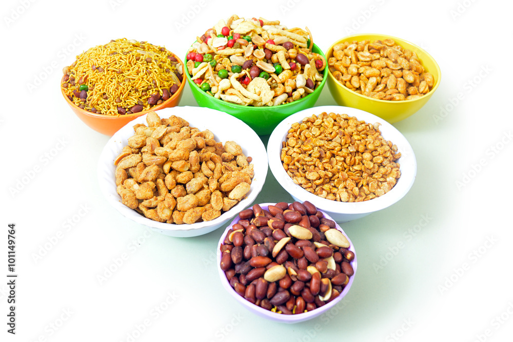 Peanut, chole and mix nimko in bowl isolated on white background Peanut, chole and mix nimko in bowl isolated on white background