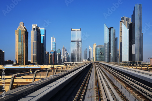 Metro on the background of skyscrapers of Dubai World Trade cent