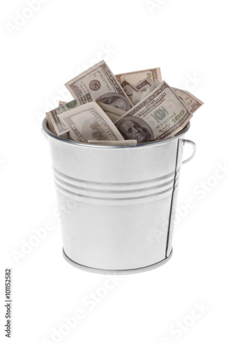 dollars in a metal bucket