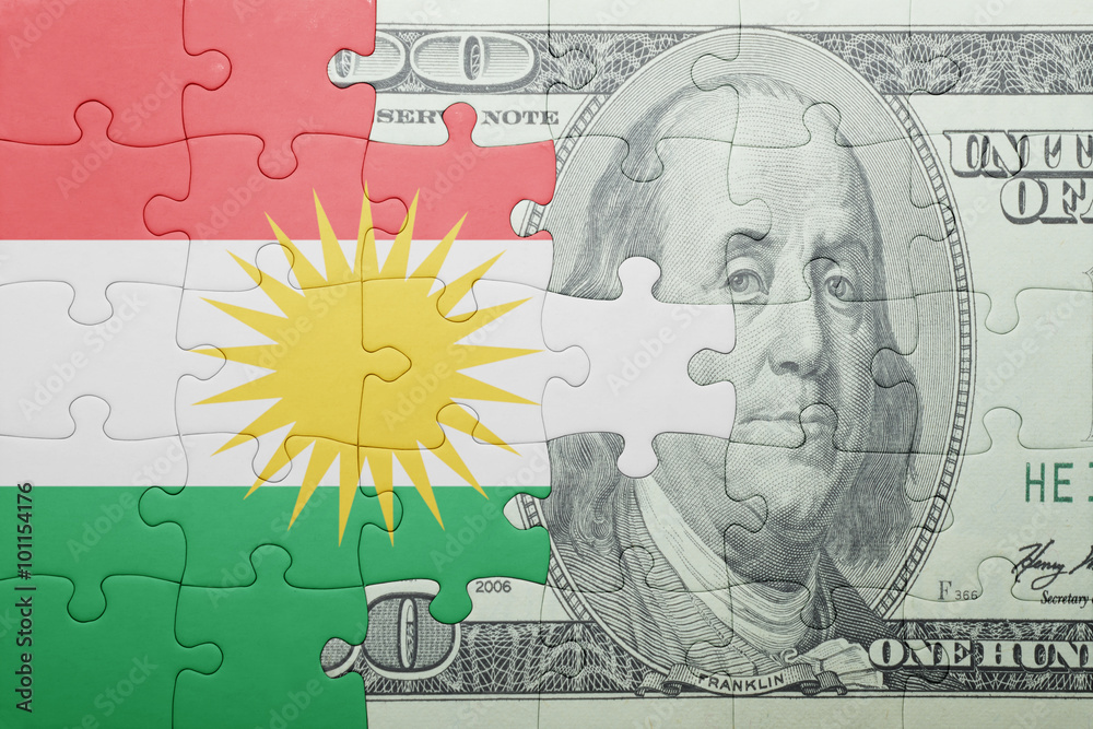 puzzle with the national flag of kurdistan and dollar banknote