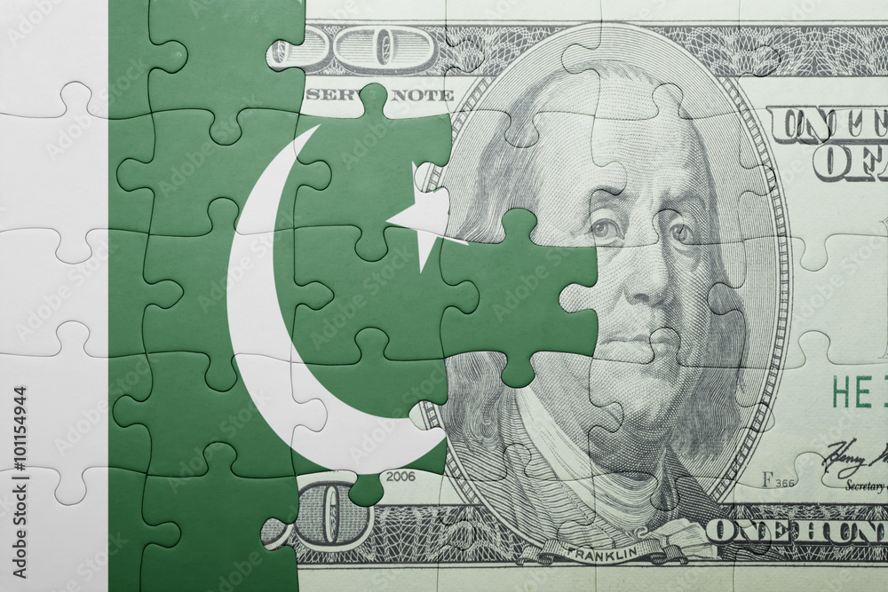 puzzle with the national flag of pakistan and dollar banknote
