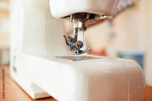 Sewing machine needle working part, detail and accessories, modern white, perspective.