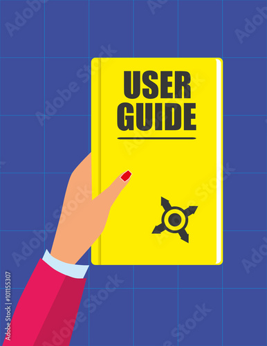 Female hand holding a yellow book with the title User Guide in text on the front cover and a small compass symbol in front of a blue background