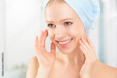 skin care. young beautiful healthy girl in towel in bathroom