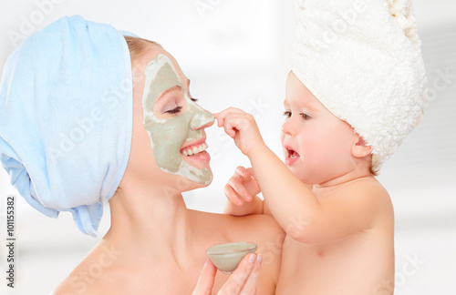 family beauty treatment in bathroom. mother and daughter baby g