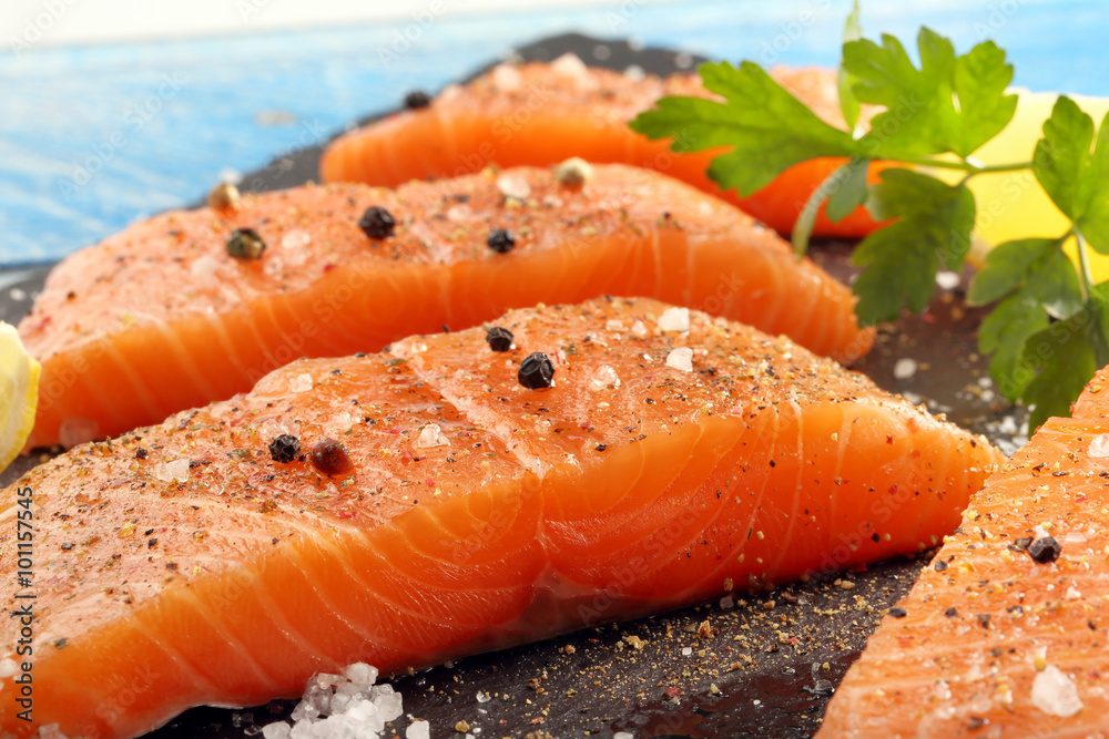 Fresh raw salmon fillet and aromatic spices for baking Fresh raw salmon fillet and aromatic spices for baking