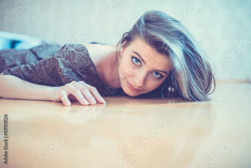 seductive woman lying on the floor