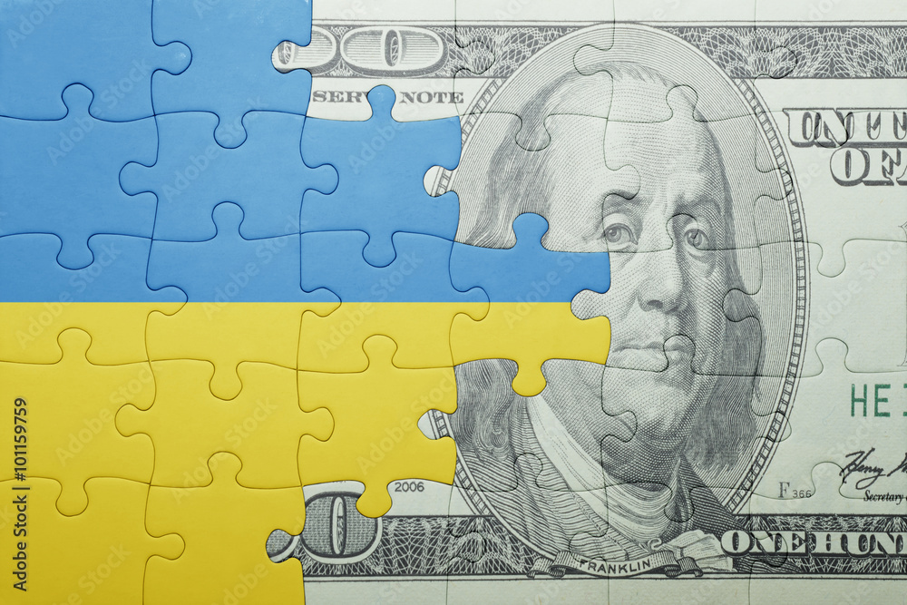 puzzle with the national flag of ukraine and dollar banknote