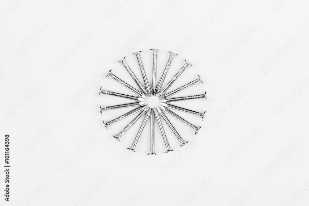 Metal nails lined circle on a white background