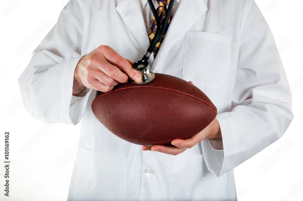 Φωτογραφία Medical doctor checking health of Football on white background