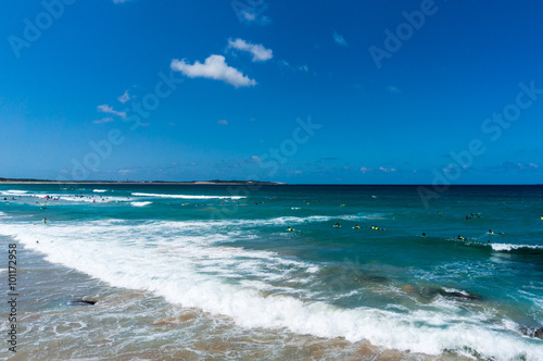 Australian ocean beach with people bathing