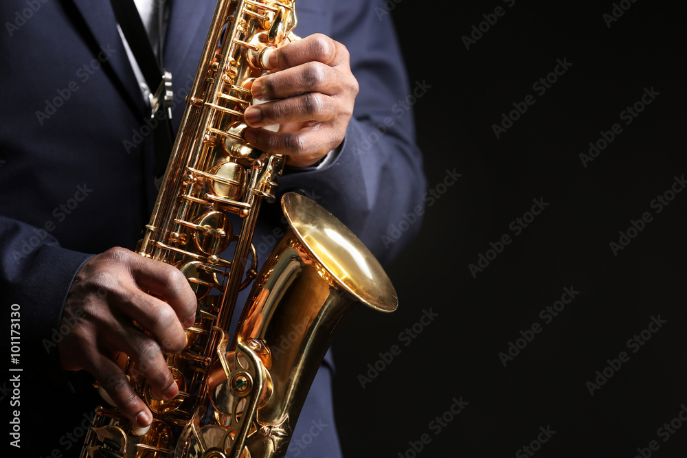 Obraz premium African American jazz musician playing the saxophone, closeup