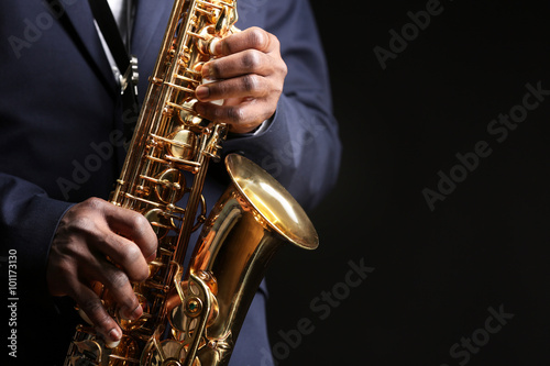 Photography African American jazz musician playing the saxophone, closeup