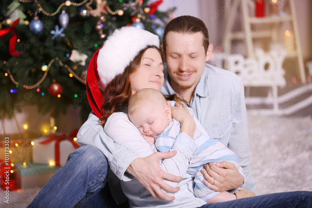 Happy family in the decorated Christmas room, close up Happy family in the decorated Christmas room, close up