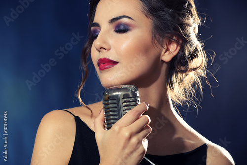 Young pretty woman singing  close up