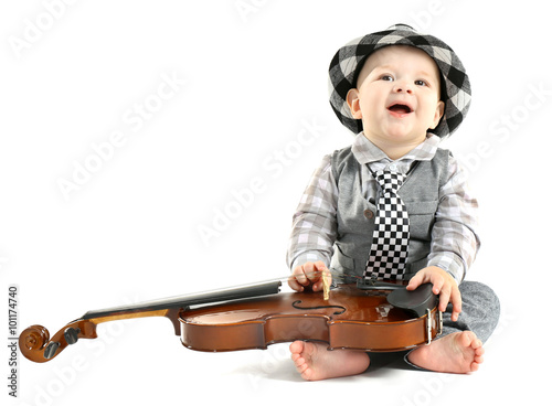 Cute baby in hat with violi...