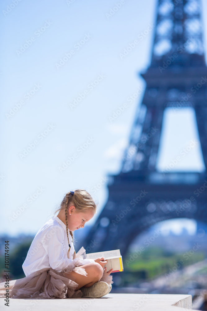 Adorable little girl in Paris background the Eiffel tower 