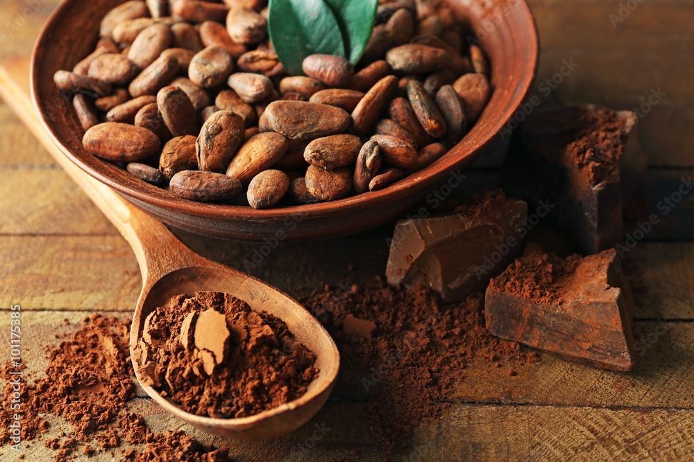 Aromatic cocoa harvest on wooden background, close up