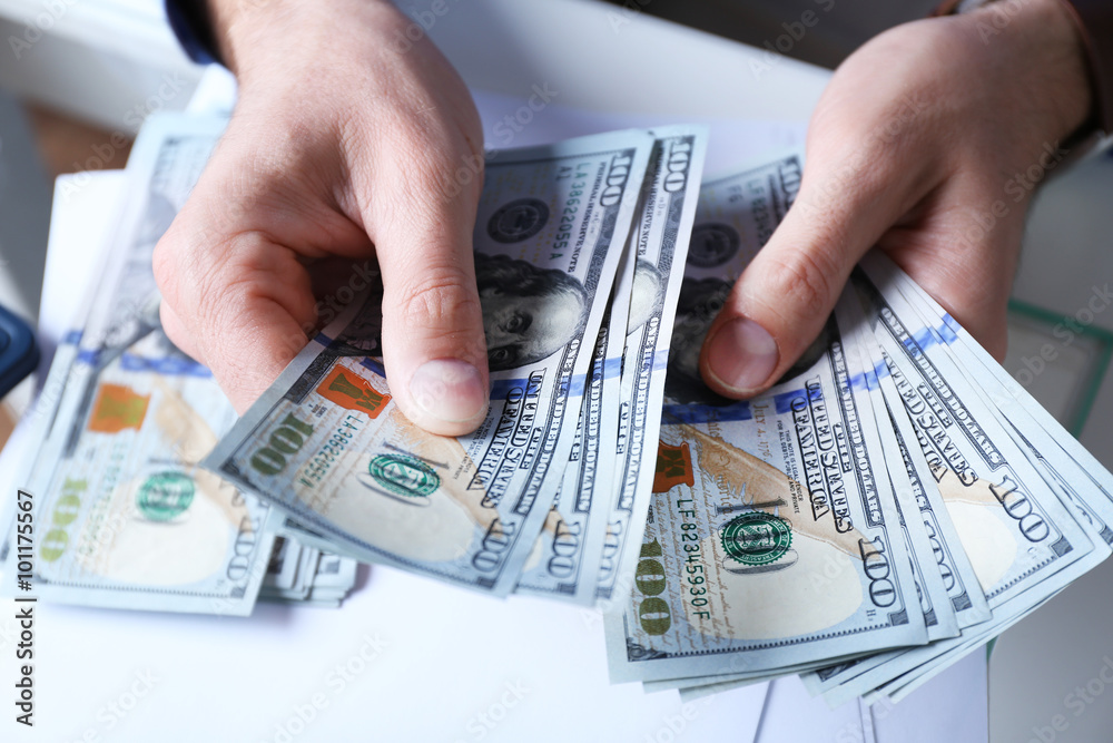 Hands counting money, close up Hands counting money, close up