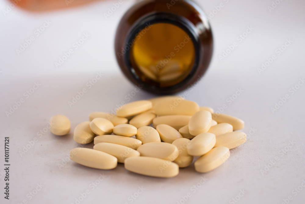 Pill bottle Spilling pills on white background Pill bottle Spilling pills on white background