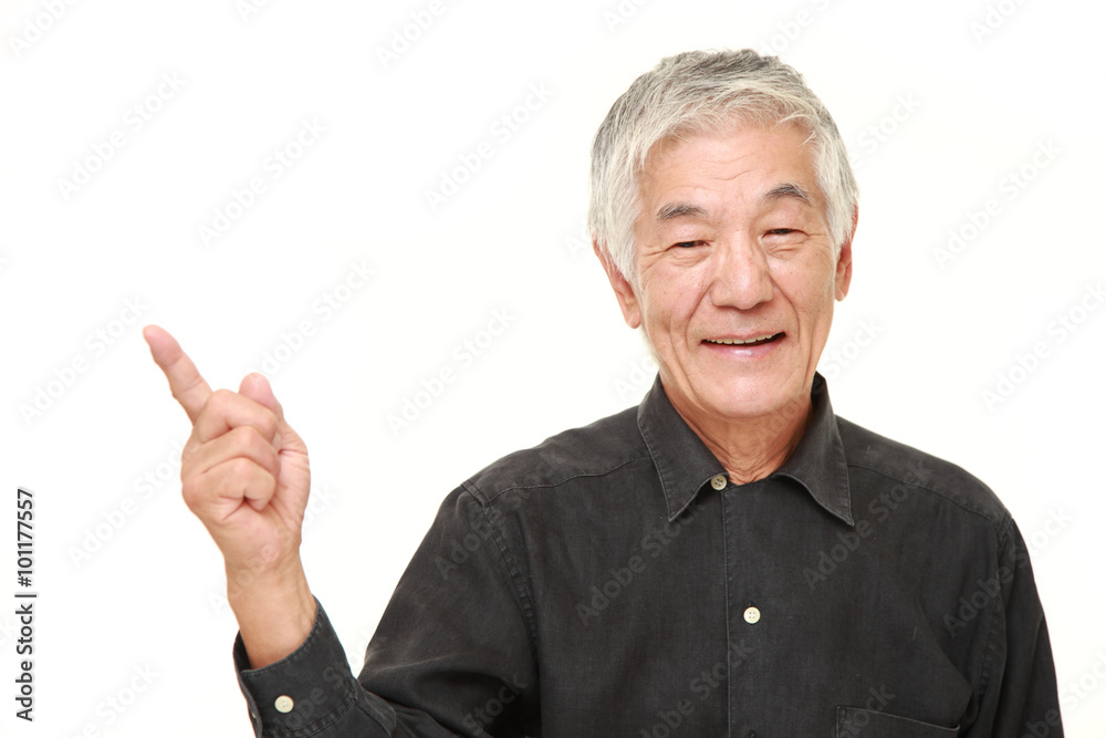senior Japanese man presenting and showing something senior Japanese man presenting and showing something