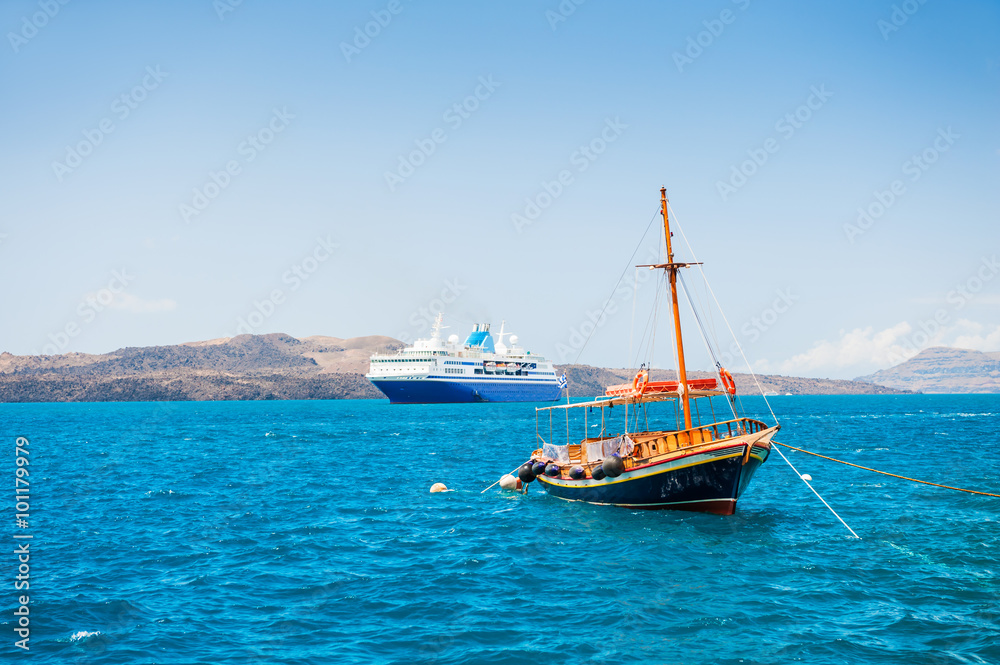 Tourist boat and cruise ship on the sea coast