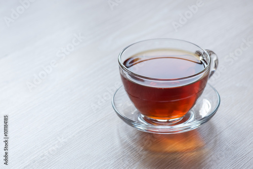 black tea in clear glass cup is on the table