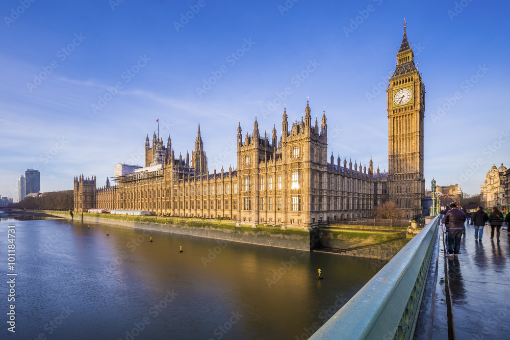 Houses of Parliament and Big Ben with River Thames on an early morning shot in central London, UK
