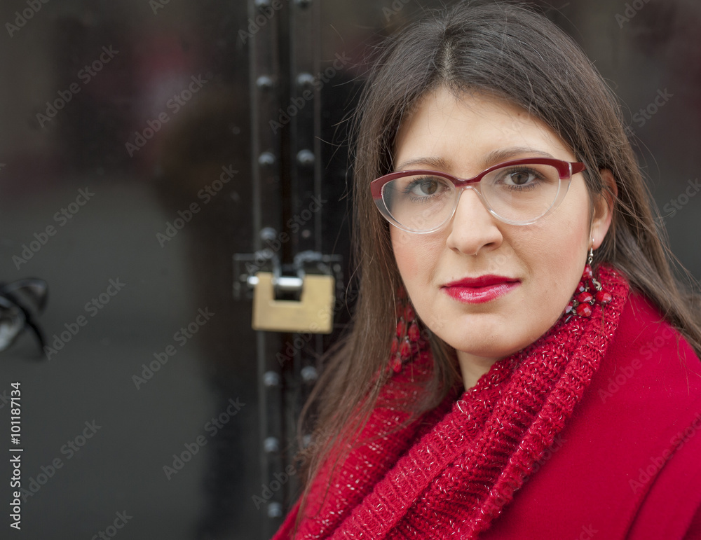 Young woman on the street at winter time. Red coat. Young woman on the street at winter time. Red coat.